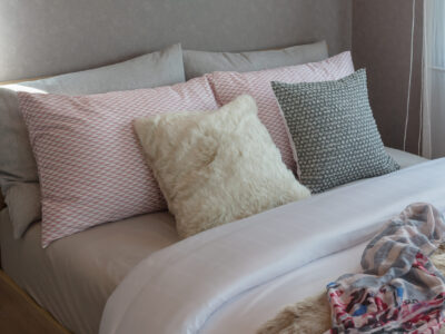 cozy bedroom with sweet color pillows cozy bedroom with sweet color pillows on bed, interior design concept