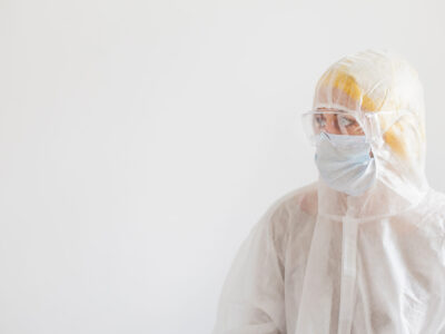 Scientist in protective wear Scientist in protective wear with glasses. Woman scientist on white background